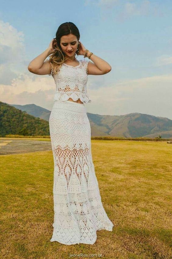 a two piece crochet wedding dress with cap sleeves, a crop top and a maxi skirt for a wild wedding in boho style