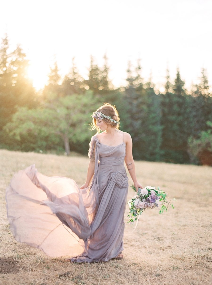 A unique purple draped wedding dress, a tender blush and lavender wedding crown and a romantic lavender and blush wedding bouquet