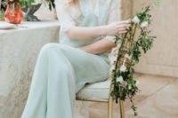 a vintage-inspired mint-colored wedding dress with lace detailing and edges for a non-traditional bride