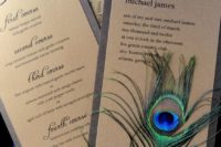 bold cardboard wedding invitations with turquoise ribbons and peacock feathers for a catchy look