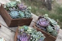 box wedding centerpieces of mint-colored succulents, cacti and purple succulents look super chic and edgy