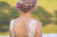 purple wedding hair in a cute braided low updo with a floral crown for a romantic bride
