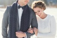 the bride rocking a white cable knit sweater and the groom with a matching navy scarf