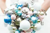 a catchy winter wedding bouquet of pink, blue, silver and metallic ornaments plus gilded branches is amazing for a holiday wedding