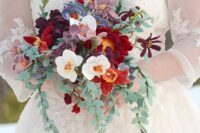 a colorful and elegant wedding bouquet of white and burgundy real blooms, mauve and red felt ones and some felt leaves is a lovely idea for the fall