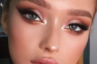 a glam and shiny holiday makeup with a glossy pink lip, pink and copper metallic eyeshadow, wings and lashes