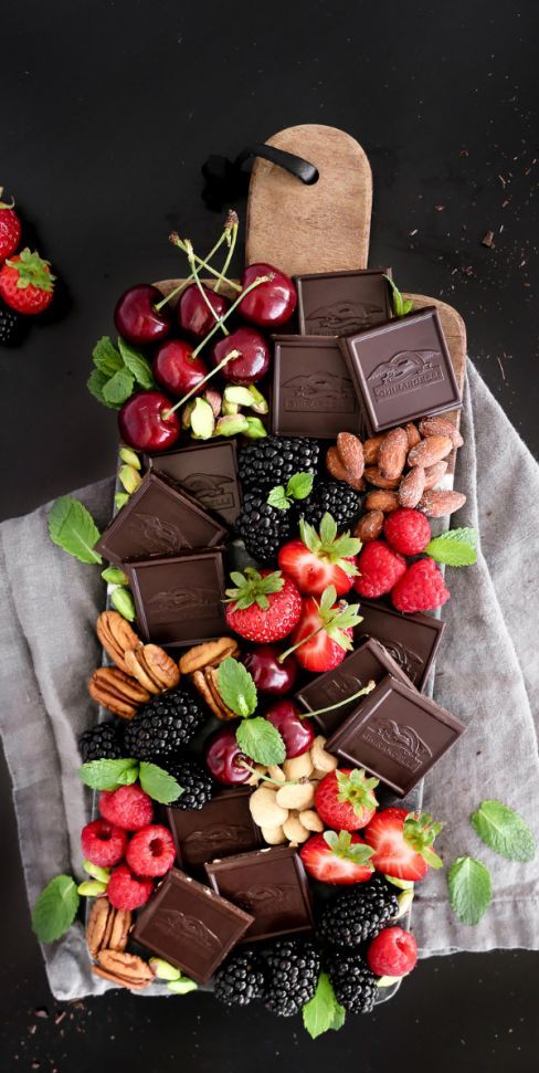 a gourmet chocolate dessert board with lots of fruits, berries and nuts is a lovely idea for every wedding and your guests will be happy