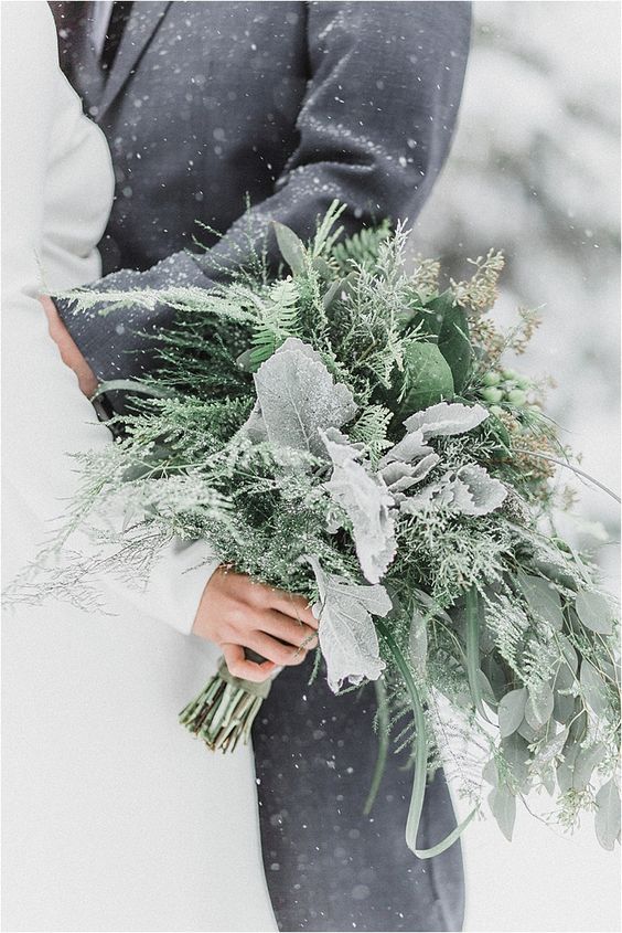 a greenery winter wedding bouquet with pale foliage, leaves, berries and grasses for a non-floral wedding