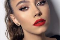 a lovely holiday makeup with a matte red lip, pink metallic eyeshadow, perfect tone and a touch of blush