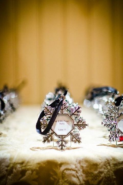 a snowflake-shaped Christmas ornament with your wedding date and names is a lovely idea for a winter wedding