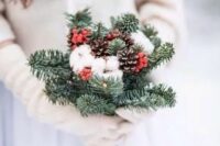 a winter bouquet of evergreens, pinecones, cotton and berries for a non-traditional bride
