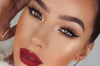 an extra glam Christmas makeup with a matte red lip, perfect tone and blush, gold eyeshadow and lash extensions
