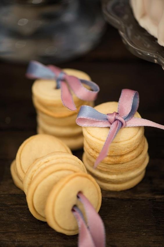 button-shaped cookies on ribbons are gorgeous wedding favors for Christmas and other weddings, too