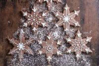chocolate gingerbread snowflake cookies with frosting are a simple and delicious idea for any winter dessert table