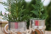 mini Christmas trees in tin cans and with cool tags are great Christmas and winter wedding favors for a rustic celebration
