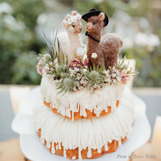 super cute and fun felt alpaca wedding cake toppers paired with blooms and greenery are amazing for a boho wedding