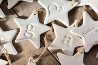 white clay star-shaped ornaments with monograms are amazing for Christmas, make them yourself