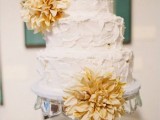 a white textural buttercream wedding cake with dried blooms is a lovely idea for a wedding in summer or fall