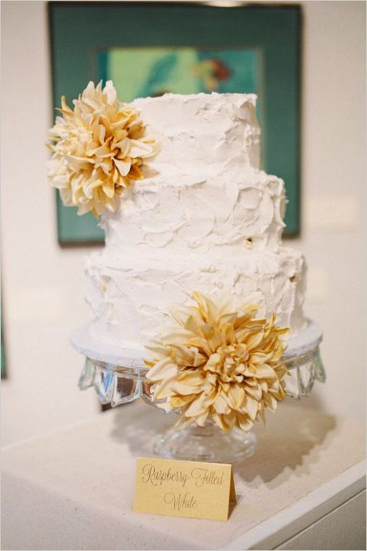 a white textural buttercream wedding cake with dried blooms is a lovely idea for a wedding in summer or fall
