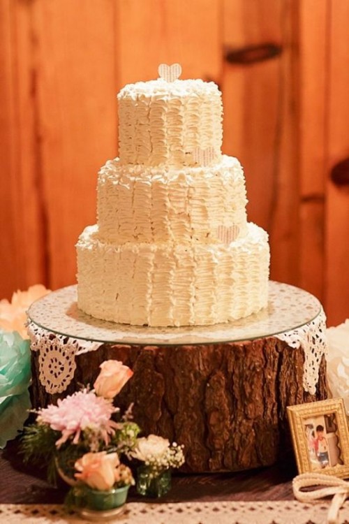 a white ruffle buttercream wedding cake topped with a single heart is a lovely idea for a rustic wedding, it looks cool and cute