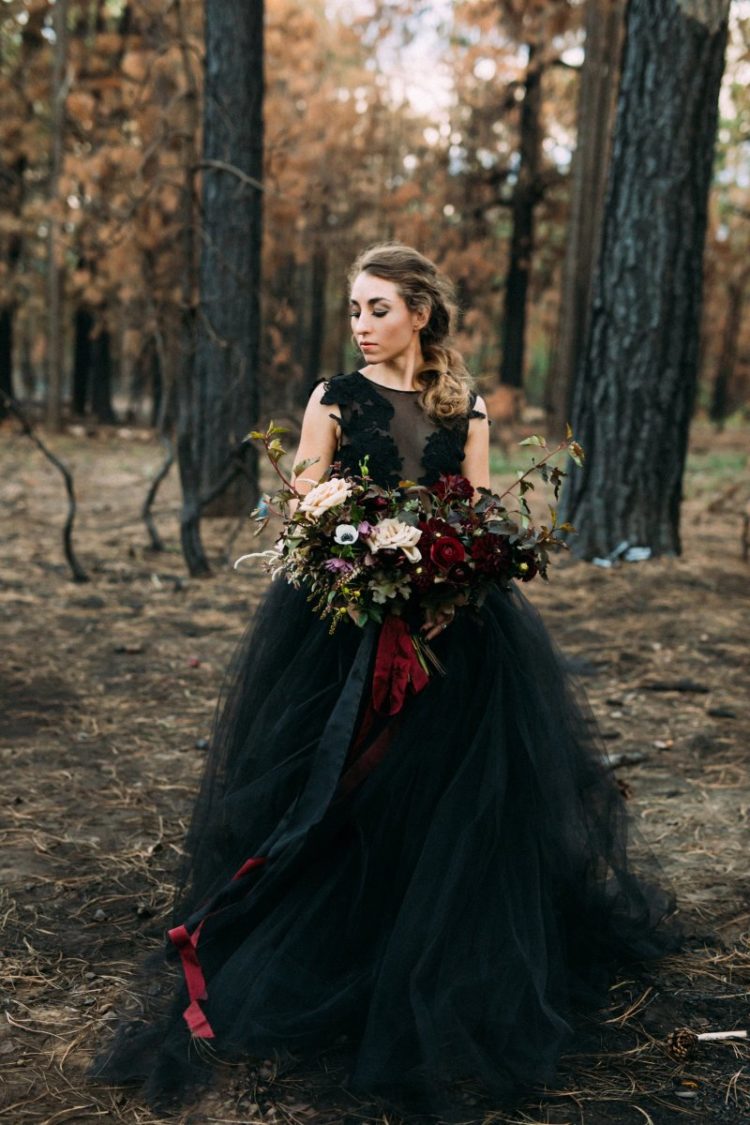 a gorgeous black sleeveless wedding ballgown with lace appliques is a stylish idea for an offbeat bride