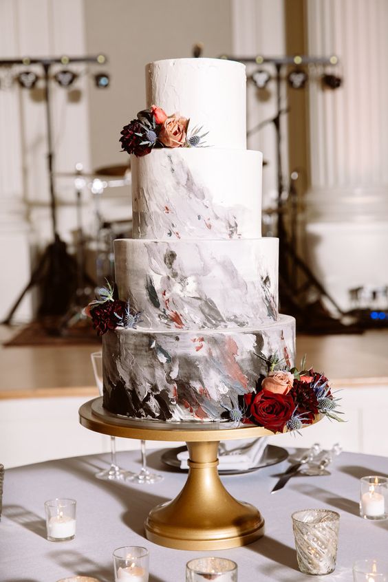 a gorgeous wedidng cake with grey and burgundy watercolors plus burgundy and blush blooms