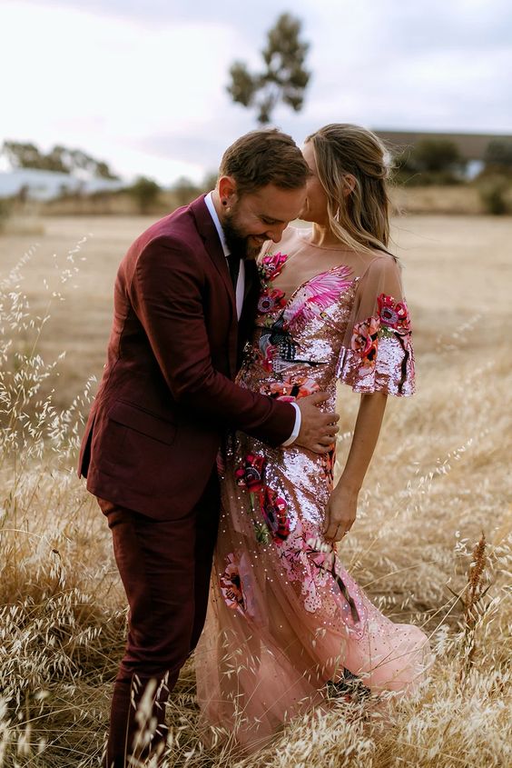 A jaw dropping pink sequin wedding dress with embroidery and sheer parts looks absolutely amazing