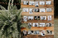 a lovely wedding decoration of a wooden wall with the couple’s photos and a chalkboard sing over it is a cool idea