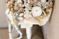 a refined vintage brooch wedding bouquet with a pocket watch and pearls is a gorgeous idea for a whimsy bride