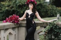a sexy black spaghetti strap mermaid wedding gown with a lace embellished bodice and lace inserts