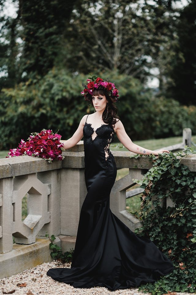 a sexy black spaghetti strap mermaid wedding gown with a lace embellished bodice and lace inserts