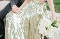 a strapless gold sequin wedding dress is a perfect glam option that will never go out of style
