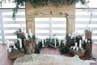 a super natural winter wedding ceremony space with tree stumps, greenery, antlers and foliage and an animal skin rug