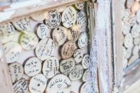 a wood slices guest book is a super creative idea for a rustic wedding, it can be DIYed easily and looks cool