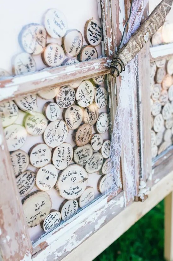 a wood slices guest book is a super creative idea for a rustic wedding, it can be DIYed easily and looks cool