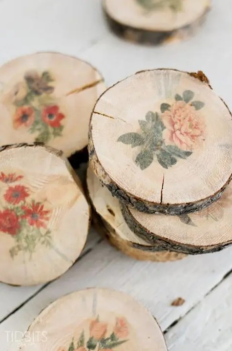 wood slices with bright floral stencils can be used for wedding decor or give as wedding favors, they are great for a rustic wedding