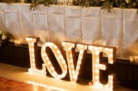 LOVE marquee letters accenting a wedding reception table are a nice decor idea that always works