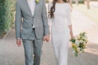 a casual plain sheath wedding dress with a high neckline, long sleeves and neutral heels to finish off the look