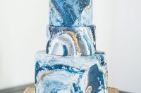 a chic black marble wedidng cake with gold leaf is a timeless idea for many modern weddings, even if you don’t rock much blue in the color scheme