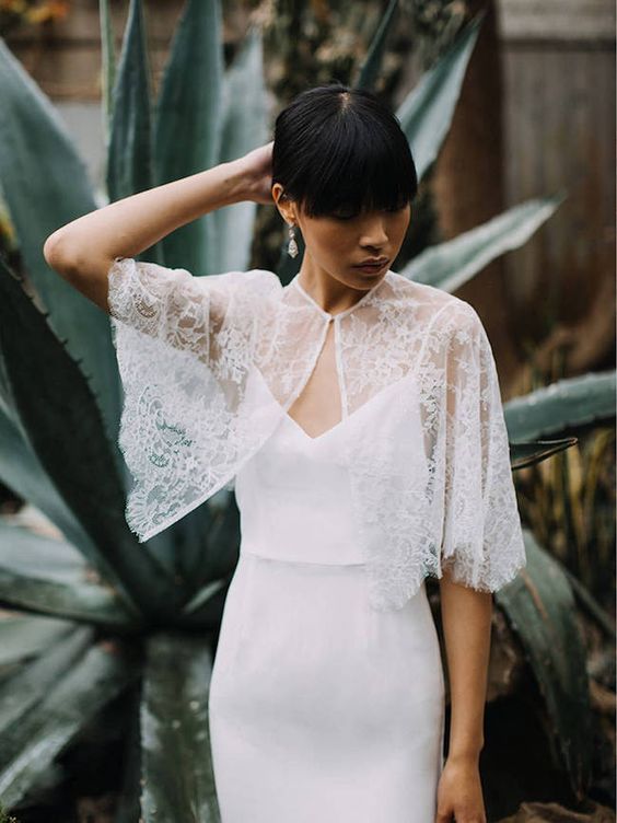 a delicate lace bridal capelet is a perfect pair for a plain wedding dress, a strapless or a spaghetti strap one