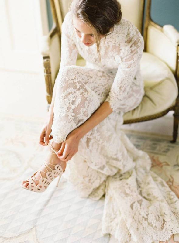 a full lace semi-fitting wedding dress with a high neckline, long sleeves and a train is a refined and beautiful idea for a church ceremony