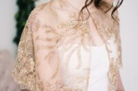 a gold beaded and embroidered capelet is a beautiful and glam solution to cover up a strapless wedding dress