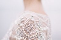 a gorgeous beaded and pearled cap sleeve will make your wedding dress refined and very chic