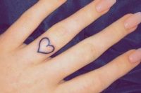 a heart-shaped tattoo on the ring finger will substitute any wedding ring and will look stylish
