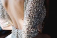 a heavily embellished and embroidered silver wedding dress bodice and short sleeves is very refined