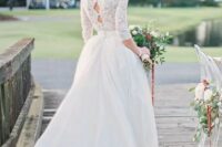 a high neckline A-line wedding dress with a lace top, half sleeves and a full skirt, keyholes on the back
