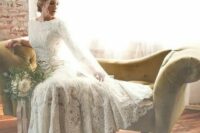 a lace applique wedding gown with a bateau neckline and long sleeves is a timeless option that never goes out of style