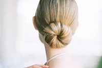 a minimalist sleek ballet bun is a chic statement for a minimal bride to rock on a big day