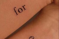 a modern idea of a wedding or couple tattoo with ‘forever’ split into two and placed on two wrists