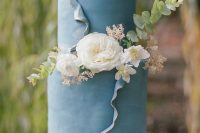 a refined dusty blue wedding cakes with ruffles, white blooms and greenery is a beautiful and chic solution for a spring or summer wedding